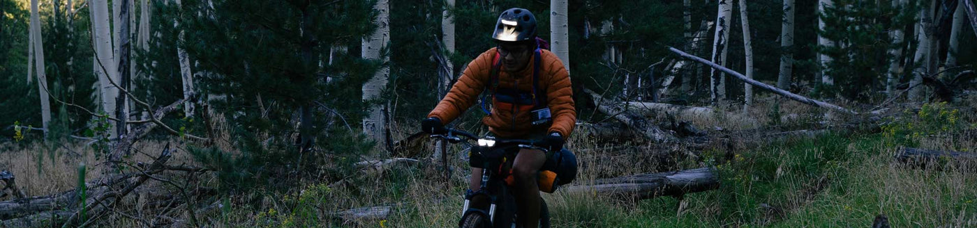 Rider riding gravel bike with bike helmet light