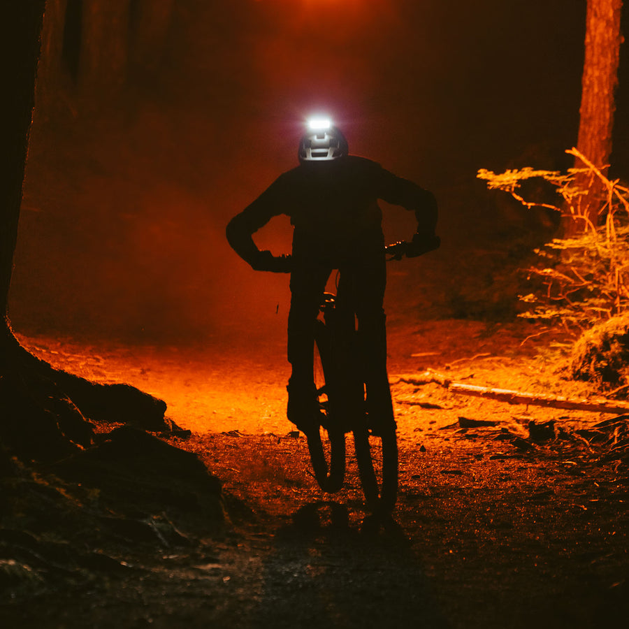 Mountain biker using Portal helmet light at night