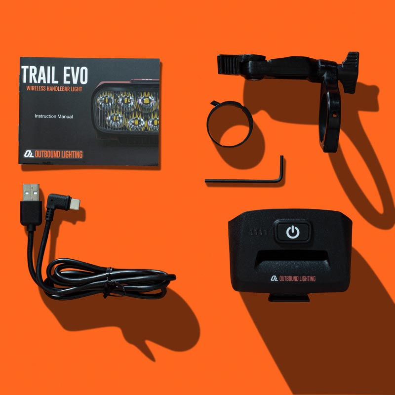 Trail Evo box contents with handlebar mount, cable and hardware
